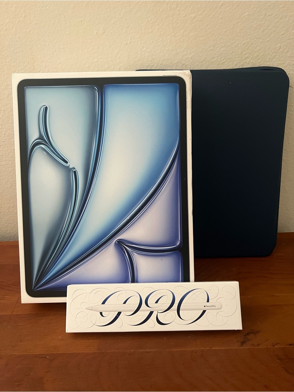 Apple iPad Pro with Dark Blue Smart Folio and Apple Pencil